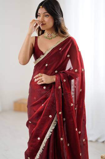 Maroon tissue satin sequins saree with unstitched blouse piece.