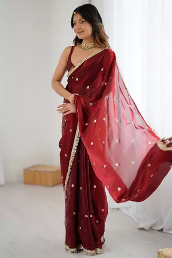Maroon tissue satin sequins saree with unstitched blouse piece.