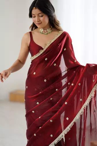 Maroon tissue satin sequins saree with unstitched blouse piece.