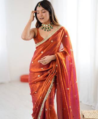 Orange tissue satin sequins saree with unstitched blouse piece. 1