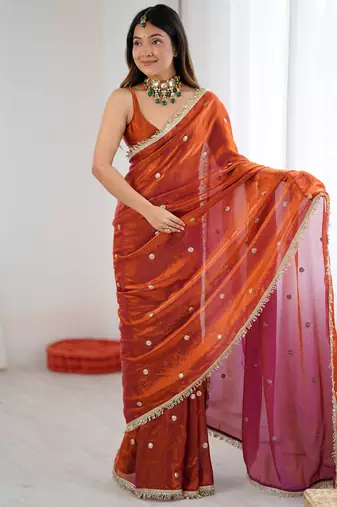Orange tissue satin sequins saree with unstitched blouse piece.