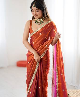 Orange tissue satin sequins saree with unstitched blouse piece. 5
