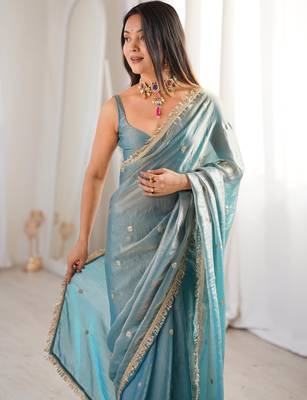 Sky blue tissue satin sequins saree with unstitched blouse piece. 1