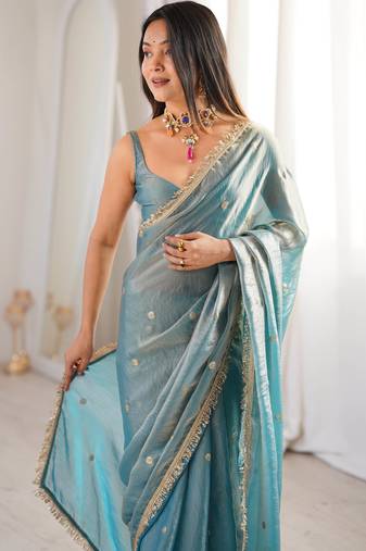 Sky blue tissue satin sequins saree with unstitched blouse piece.