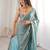 Sky blue tissue satin sequins saree with unstitched blouse piece.