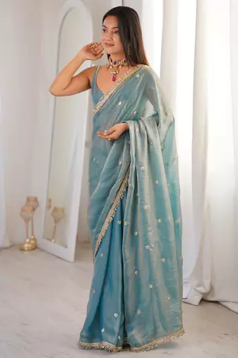 Sky blue tissue satin sequins saree with unstitched blouse piece.