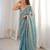 Sky blue tissue satin sequins saree with unstitched blouse piece.