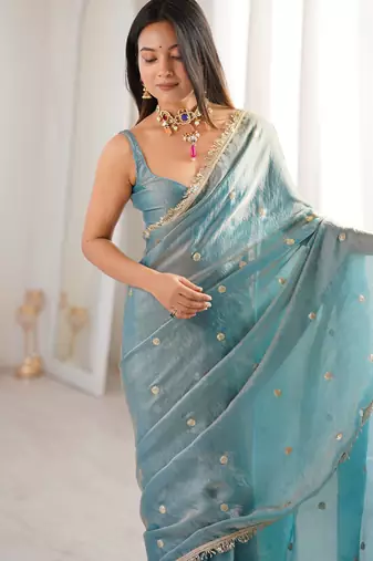 Sky blue tissue satin sequins saree with unstitched blouse piece.