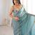 Sky blue tissue satin sequins saree with unstitched blouse piece.