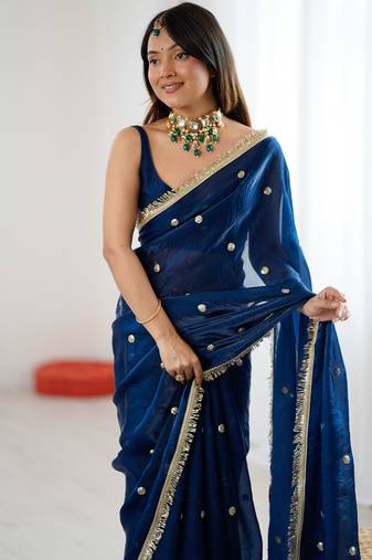 Teal tissue satin sequins saree with unstitched blouse piece.