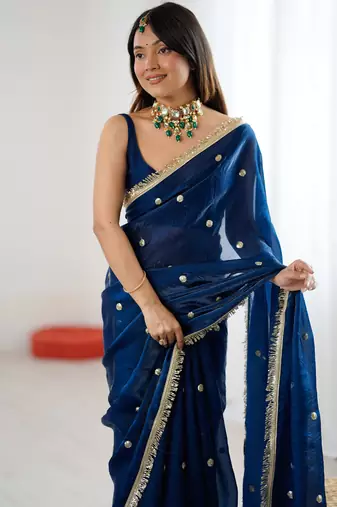 Teal tissue satin sequins saree with unstitched blouse piece.