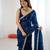 Teal tissue satin sequins saree with unstitched blouse piece.