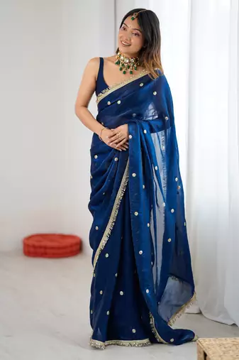 Teal tissue satin sequins saree with unstitched blouse piece.