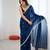 Teal tissue satin sequins saree with unstitched blouse piece.