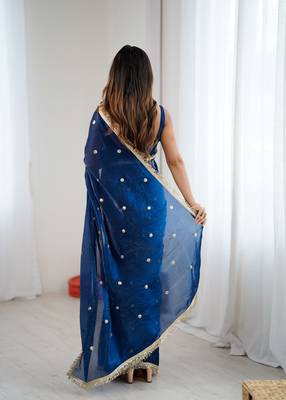Teal tissue satin sequins saree with unstitched blouse piece. 4
