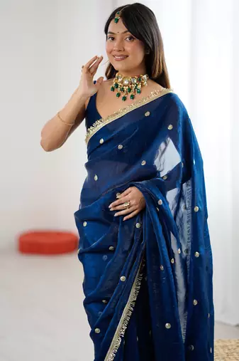 Teal tissue satin sequins saree with unstitched blouse piece.