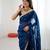 Teal tissue satin sequins saree with unstitched blouse piece.