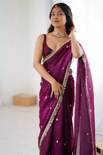 Wine tissue satin sequins saree with unstitched blouse piece.