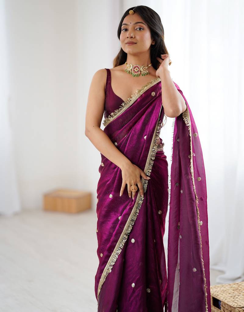 Wine tissue satin sequins saree with unstitched blouse piece.