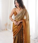 Gold tissue satin sequins saree with unstitched blouse piece.