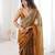 Gold tissue satin sequins saree with unstitched blouse piece.