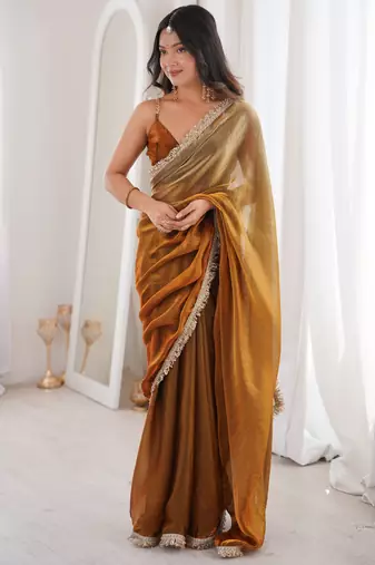 Gold tissue satin sequins saree with unstitched blouse piece.