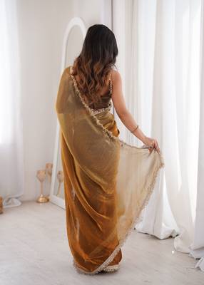Gold tissue satin sequins saree with unstitched blouse piece. 5