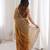 Gold tissue satin sequins saree with unstitched blouse piece.