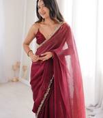 Maroon tissue satin sequins saree with unstitched blouse piece.