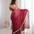 Maroon tissue satin sequins saree with unstitched blouse piece.