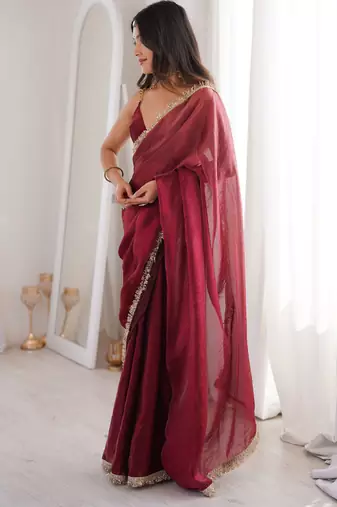 Maroon tissue satin sequins saree with unstitched blouse piece.