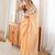 Mustard tissue embellished saree with unstitched blouse piece.