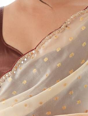 Mustard tissue embellished saree with unstitched blouse piece. 4