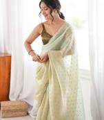 Olive tissue embellished saree with unstitched blouse piece.