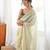 Olive tissue embellished saree with unstitched blouse piece.