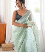 Sea green tissue embellished saree with unstitched blouse piece.