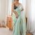 Sea green tissue embellished saree with unstitched blouse piece.