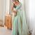 Sea green tissue embellished saree with unstitched blouse piece.