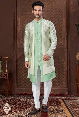 Cream indo-western set in an attached jacket style, with full embroidery, sequins,and thread work. 1
