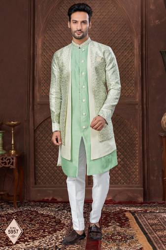 Cream indo-western set in an attached jacket style, with full embroidery, sequins,and thread work.