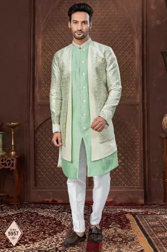 Cream indo-western set in an attached jacket style, with full embroidery, sequins,and thread work.