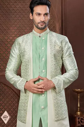 Cream indo-western set in an attached jacket style, with full embroidery, sequins,and thread work.