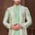 Cream indo-western set in an attached jacket style, with full embroidery, sequins,and thread work.