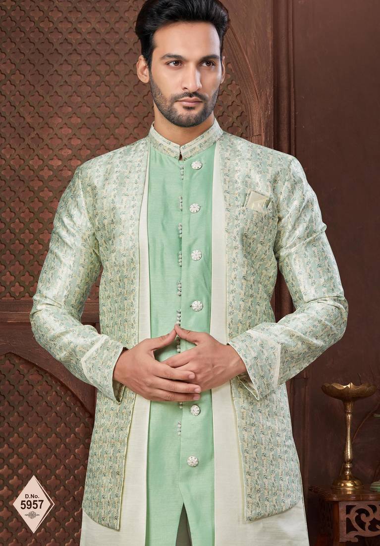 Cream indo-western set in an attached jacket style, with full embroidery, sequins,and thread work.