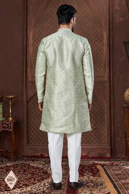 Cream indo-western set in an attached jacket style, with full embroidery, sequins,and thread work. 3