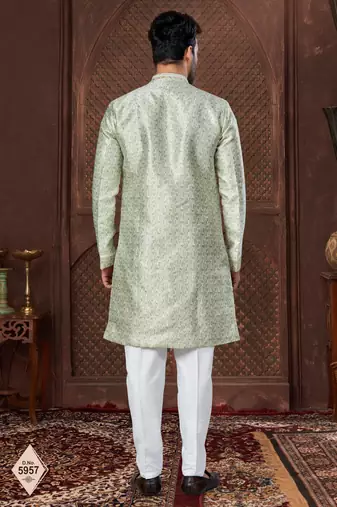 Cream indo-western set in an attached jacket style, with full embroidery, sequins,and thread work.
