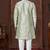 Cream indo-western set in an attached jacket style, with full embroidery, sequins,and thread work.