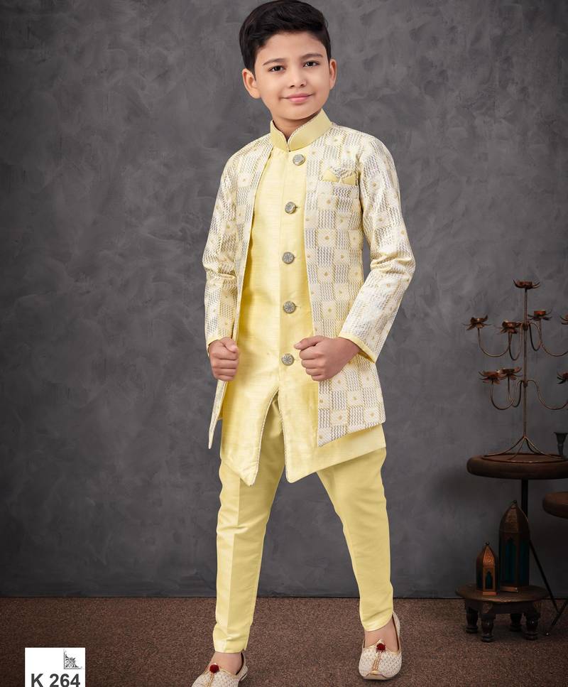 Lemon yellow jacket attached indo-western  set with computer stone work, lace & fancy buttons