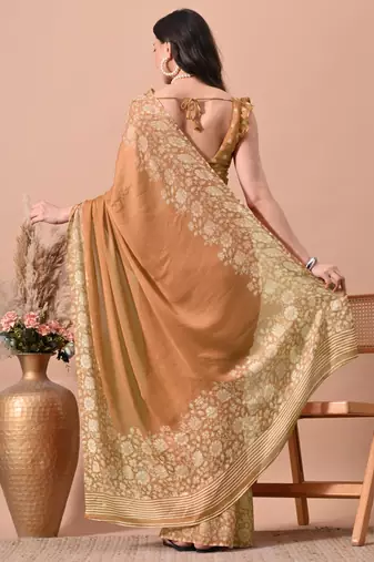 Women's orange floral print chiffon saree with unstitched blouse piece
