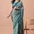 Women's teal floral print chiffon saree with unstitched blouse piece